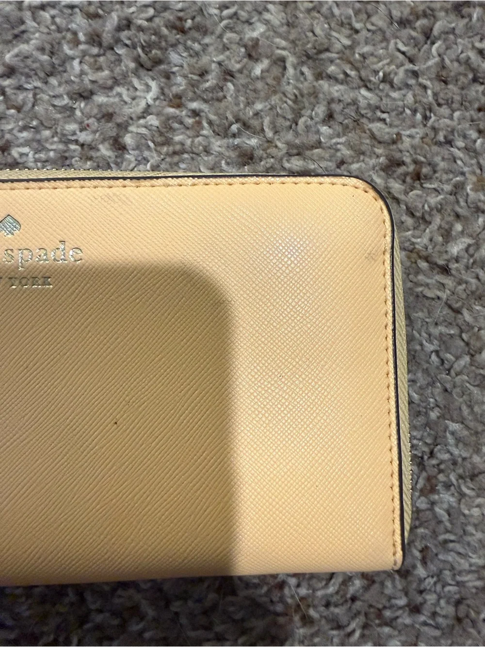 kate spade pale yellow zip-around wallet